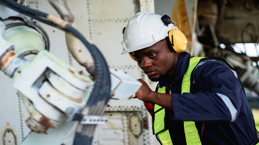 An aircraft maintenance technician at work